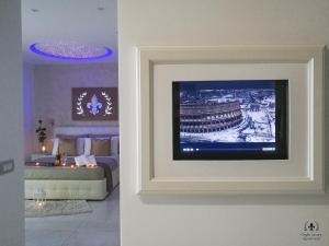 TV in/ali zabaviščno središče v nastanitvi Giglio Luxury Apartment - Chroma Italy
