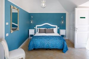 Säng eller sängar i ett rum på Villa Don Camillo