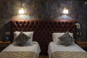 Letto o letti in una camera di Omart Hotel - Gallery