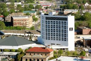 an aerial view of a large white building in a city at The Hotel Hot Springs in Hot Springs