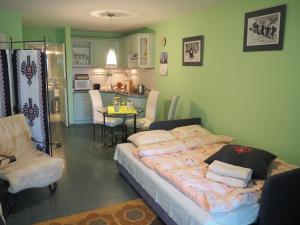 Posteľ alebo postele v izbe v ubytovaní Apartament Zielone Studio