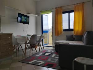 a living room with a couch and a table at Lovely Apartment in Golem