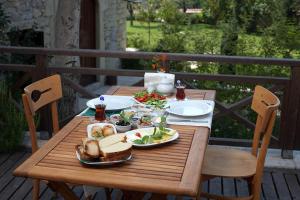 a wooden table with plates of food on it at Pacacioglu Bag Evi in Safranbolu