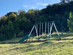 a playground with a slide in a field at Terrazas altos de Gamboa in Castro
