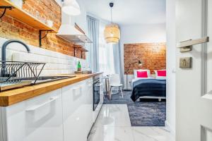 Η κουζίνα ή μικρή κουζίνα στο Apartamenty Lubartowska Street