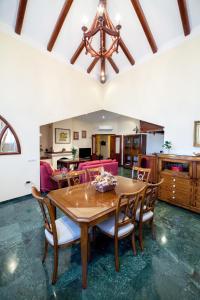 a dining room with a wooden table and chairs at LA ATALAYA GREAT LUXURY ATTIC in Antequera