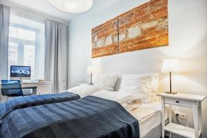 Ένα ή περισσότερα κρεβάτια σε δωμάτιο στο Apartamenty Lubartowska Street