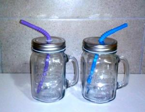 two glass mason jars with blue and purple drinking straws at Berlin apartment in Brčko