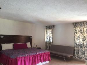 Cama o camas de una habitación en Hotel Ollin Teotl