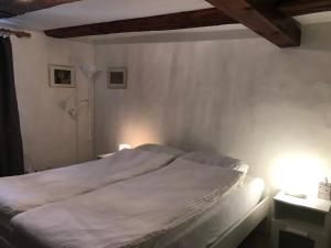 Voodi või voodid majutusasutuse Guesthouse Les Mignardises toas