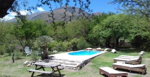 a swimming pool in the middle of a yard at Monte Capilla in Capilla del Monte