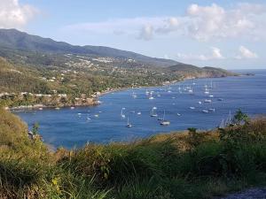 a view of a bay with boats in the water at Kanalu Studio in Bouillante