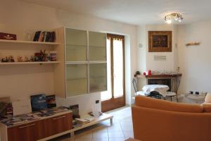 a living room with a couch and a table at Villetta Nembra in Edolo