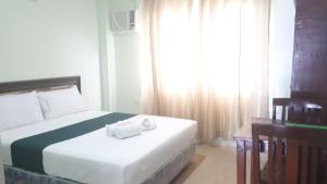 Katil atau katil-katil dalam bilik di Adams View Hotel