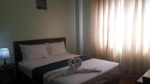 Katil atau katil-katil dalam bilik di Adams View Hotel
