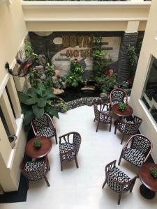 an overhead view of a patio with chairs and a pond at Royal Hotel in Ho Chi Minh City