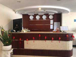 an office with clocks on the wall and a counter at Royal Hotel in Ho Chi Minh City