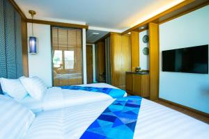 Postel nebo postele na pokoji v ubytování Lavana Hotel Chiangmai