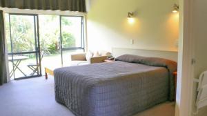 Postel nebo postele na pokoji v ubytování Sunset Motel