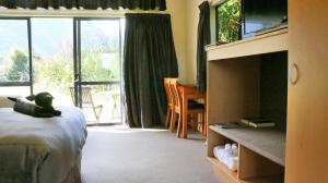 Postel nebo postele na pokoji v ubytování Sunset Motel