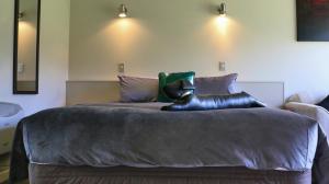 Postel nebo postele na pokoji v ubytování Sunset Motel
