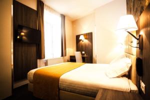 Cama o camas de una habitación en Dansaert Hotel