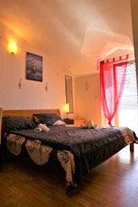 a bedroom with a large bed in a room at Apartments Muic in Tisno