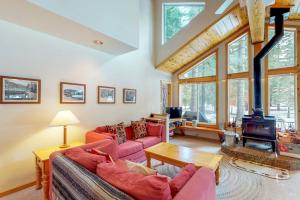 a living room with two couches and a fireplace at Happy Family Cozy Cabin in Truckee