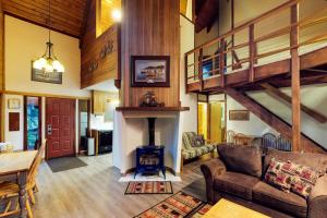 a living room with a fireplace in a house at Vail Chalet in Girdwood