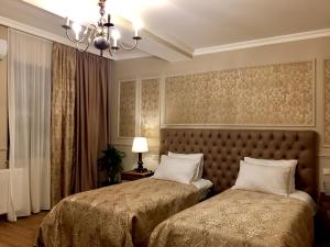 Letto o letti in una camera di Omart Hotel - Gallery