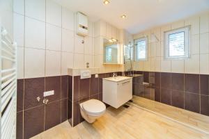 Kúpeľňa v ubytovaní Apartment Residence Narona + 28 fotografií