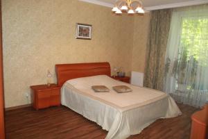 Cama o camas de una habitación en Ugodessa Apartments