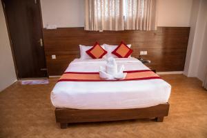 Łóżko lub łóżka w pokoju w obiekcie Hotel Himalayan Vacation