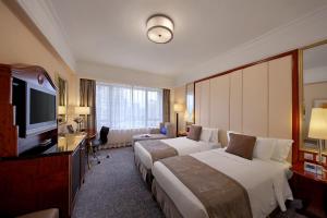 Voodi või voodid majutusasutuse Hotel Royal Macau toas