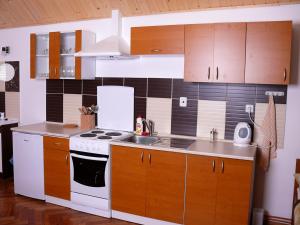 A kitchen or kitchenette at Apartmány Jahoda