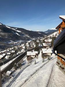an aerial view of a town with snow covered buildings at Charmant studio à Méribel avec cheminée in Méribel