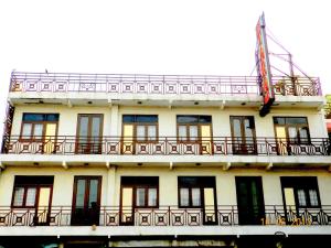 a building with balconies on the side of it at Hotel Tara Palace, Chandni Chowk in New Delhi