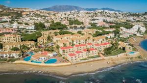 an aerial view of a resort on the beach at Macdonald Doña Lola Resort in La Cala de Mijas