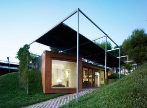 a house with a glass roof on a hill at Centro de Agroecologia y Medio Ambiente de Murcia in Bullas