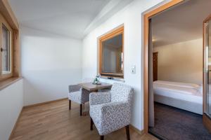 Postel nebo postele na pokoji v ubytování Hotel Alpenrose