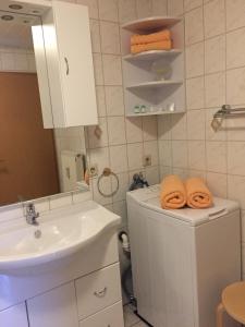 a bathroom with a sink and a counter with towels at FeWo Lahnblick in Löhnberg