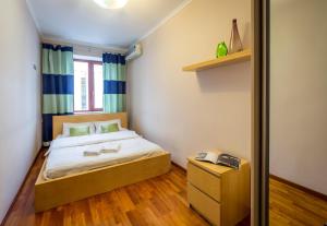Кровать или кровати в номере Apartment on Triokhsviatytelska