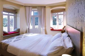 Llit o llits en una habitació de Tekla Palace By Urban Hotels