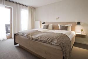 Postel nebo postele na pokoji v ubytování Bavaria Biohotel