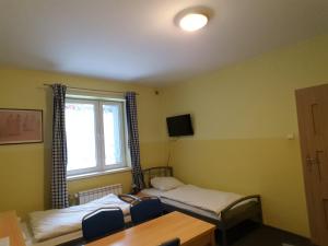 Voodi või voodid majutusasutuse Hostel Poznań Petit toas