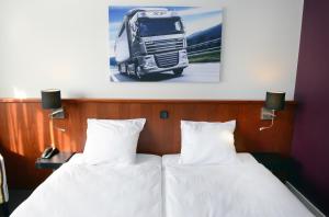 Amrâth Hotel Eindhoven tesisinde bir odada yatak veya yataklar