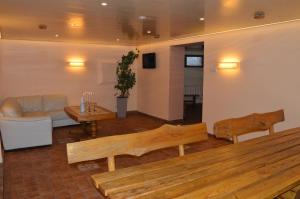 a living room with a couch and a table at Maza Kalna 27 in Riga