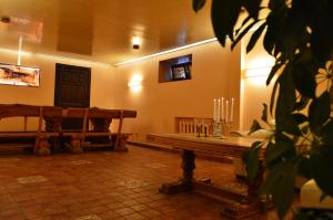 a room with a bench and some candles in it at Maza Kalna 27 in Riga