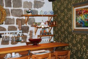 a dining room with a wooden table and chairs at La scaletta in Bolsena