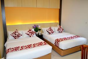 Postel nebo postele na pokoji v ubytování City Central Hotel